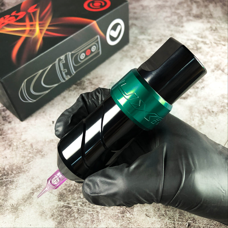 Close-up of FluxMax Wireless Pen Tattoo Machine in Green color with adjustable voltage control.